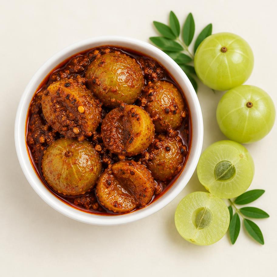 Amla pickle with whole gooseberries in masala and fresh amla beside